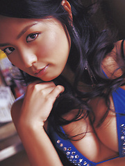 Cute asian babe in a purple bikini shows her big massive boobs - Japarn porn pics at JapHole.com