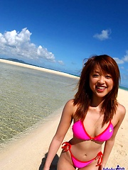 Asian babe Asuka shows off her great tits in the sun - Japarn porn pics at JapHole.com