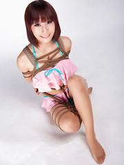 Ayako Asian leering babe has big smile on face as is tied in rope - Japarn porn pics at JapHole.com