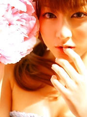Yumi Sugimoto Asian is sexy baby surrounded by colorful flowers - Japarn porn pics at JapHole.com