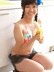 Sweet Ayana Tanigaki smiles and poses at the kitchen with banana - Japarn porn pics at JapHole.com