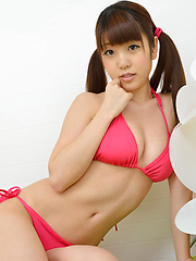 Mizuho Shiraishi with cans in pink bath suit plays with her hair - Japarn porn pics at JapHole.com