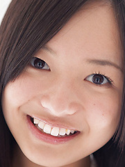 Mayumi Yamanaka Asian smiles while undressing with erotic moves - Japarn porn pics at JapHole.com