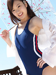 Kana Yuuki Asian in bath suit plays with umbrella in the balcony - Japarn porn pics at JapHole.com