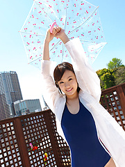 Kana Yuuki Asian in bath suit plays with umbrella in the balcony - Japarn porn pics at JapHole.com
