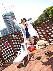 Kana Yuuki Asian in bath suit plays with umbrella in the balcony - Japarn porn pics at JapHole.com