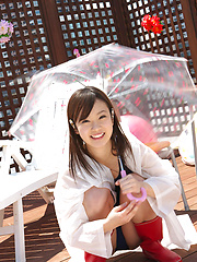 Kana Yuuki Asian in bath suit plays with umbrella in the balcony - Japarn porn pics at JapHole.com
