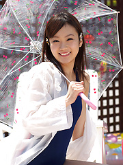 Kana Yuuki Asian in bath suit plays with umbrella in the balcony - Japarn porn pics at JapHole.com