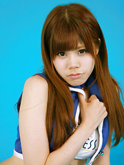 Asuka Nakano Asian with nasty smile poses in very short skirt