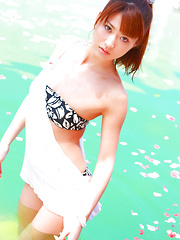 Saki Yamaguchi Asian spoils leering body in water with petals - Japarn porn pics at JapHole.com