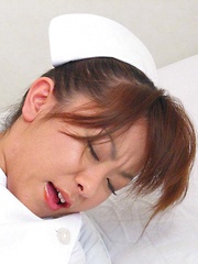 Japanese nurse Miina Minamoto alone and toying in a room - Japarn porn pics at JapHole.com