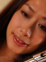 Slutty Yayoi Yanagida posing with her flute - Japarn porn pics at JapHole.com