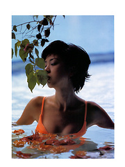 Aki Hoshino Asian tries to hide cans and shows appetizing behind - Japarn porn pics at JapHole.com