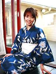 Momoko Tani Asian exposes sexy legs under geisha dress and smiles - Japarn porn pics at JapHole.com